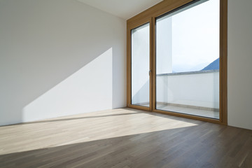 empty room with window and parquet