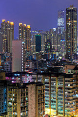 Naklejka premium Hong Kong with crowded buildings at night