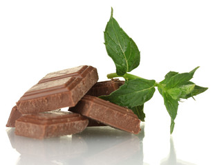 Pieces of chocolate and mint isolated on white