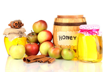 Honey and apples with cinnamon isolated on white