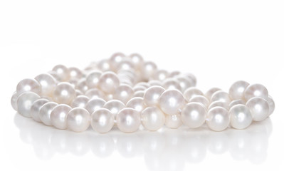 String of pearls on white background
