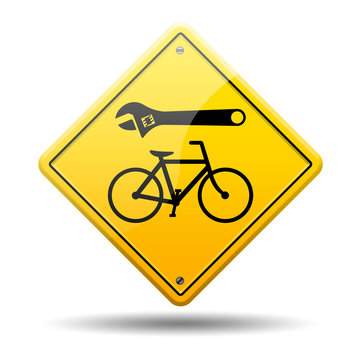 Se&ntilde;al amarilla reparacion de bicicletas