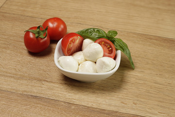 Mozzarella with basil and tomatoes