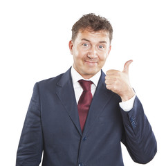 Smiling businessman with thumb up