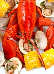 Poster Boiled lobster dinner with clams and corn © David Smith