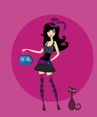 Halloween witch standing with pumpkin