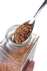 spoon in glass pot with instant coffee