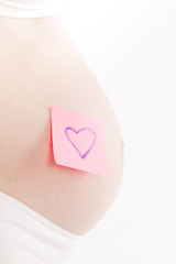 pregnant woman with sticker