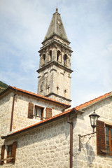 Fototapeta na wymiar Belfry or bell tower of an old church of European design.