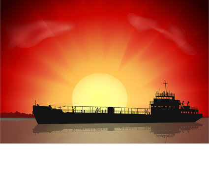 Silhouettes of old tanker on sunset