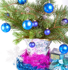 fur-tree branches, a tinsel and a gift box