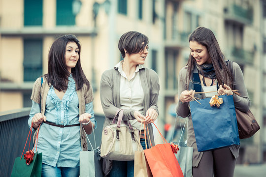 Three Beautiful Young Women with Shopping Bags