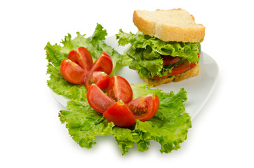 Tomatoes and cucumbers on white