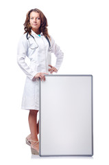 Woman doctor with blank board