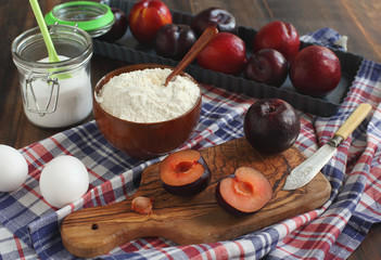 Making a sweet plum tart with almonds