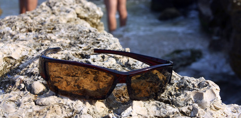 Sunglasses on the stone coast