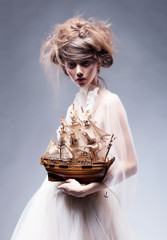 Creative art. Sophisticated woman in white vintage dress