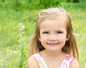 Cute little girl on the meadow