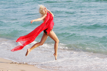 young happy woman on sea background