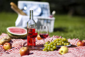 Picnic basket on green lawn