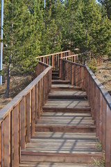 Fototapeta na wymiar Drewniane schody z poręczami