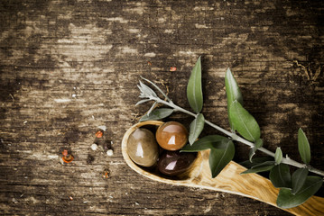 Fresh olives on a rustic wooden table