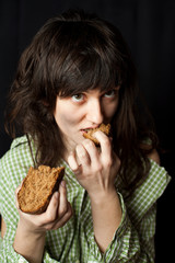 beggar woman eating bread
