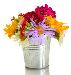 beautiful bouquet of bright wildflowers in bucket, isolated