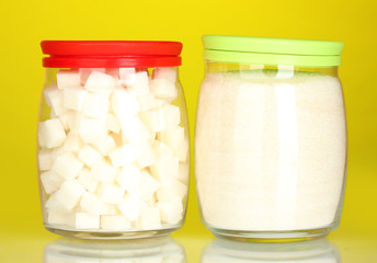 Jars with white lump sugar and white crystal sugar