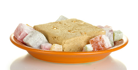 tasty halva and turkish delight in the plate isolated