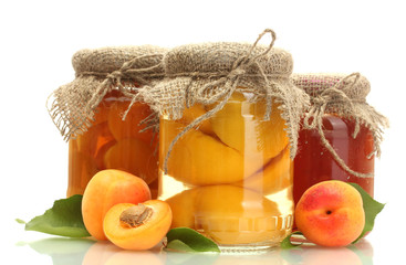 canned apricots and jam in a jars with sweet apricots isolated