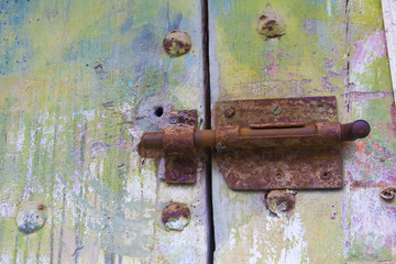 Old door with rusty latch.