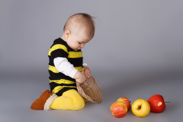 Little baby with apples