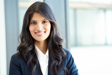 beautiful young indian businesswoman portrait in office - Powered by Adobe
