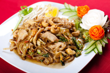 Thai style noodle stir fry with meat and cashew nut