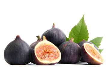 Ripe sweet figs with leaves isolated on white