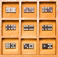 Dominos in wooden shadow box