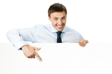 Businessman showing signboard, on white