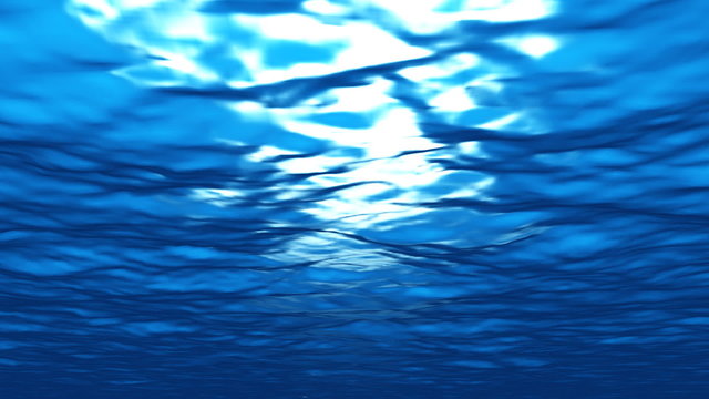 Underwater scene with shadows passing by and lightrays going thr