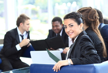 Closeup of attractive woman with group of people in