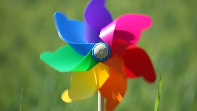 Colorful windmill in a field of wheat