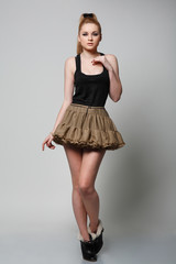 A beautiful young woman is in dark  clothes