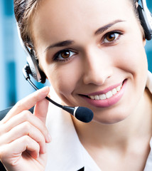 Happy smiling support phone operator at office