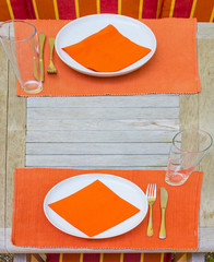 tableclothes at a teak table in the garden