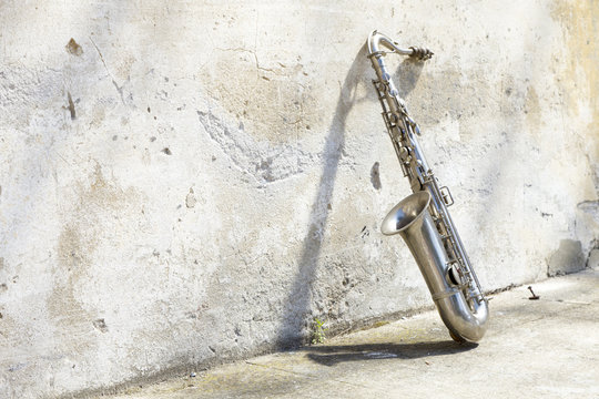 sax in front of a vintage wall
