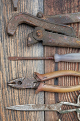 The old working tool against old wooden planks