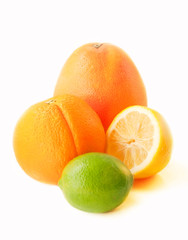 Ripe citrus fruits over white