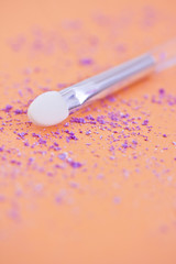cosmetics: eyeshadow and make-up brush