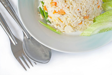 fried rice on dish with spoon and fork