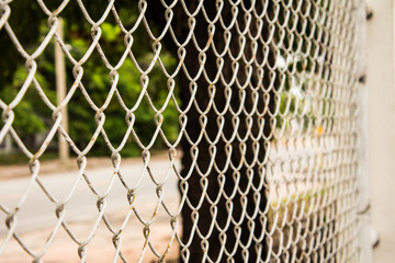High mesh fence used to not pass out.
